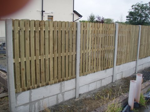 Round Top Ribbed Hit & Miss in Concrete Posts and with Gravel Boards